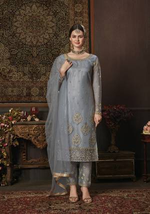 Add This New Shade To Your Wardrobe With This Heavy Designer Straight Suit In Steel Blue Color. Its Embroidred Top And Dupatta Are Net Based Paired With Soft Silk Bottom. Buy Now.