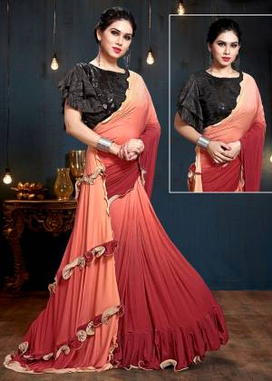Add This Beautiful Designer Saree To Your Wardrobe In Peach And Red Color Paired With Black Colored Blouse. This Saree And Blouse Are Fabricated On Fancy Fabric Which Is Light Weight And Durable. 