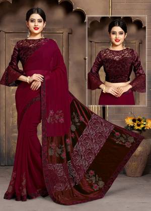 Get Ready For The Upcoming Wedding Season Wearing This Designer Saree In Maroon Color. This Saree And Blouse Are Fancy Fabric Based Beautified With Fancy Work. 