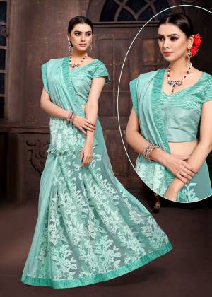 Add This Beautiful Designer Saree To Your Wardrobe In Aqua Blue Color Paired With Aqua Blue Colored Blouse. This Saree And Blouse Are Fabricated On Fancy Fabric Which Is Light Weight And Durable. 