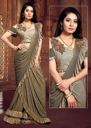 Look Pretty This Ready To Wear Design Designer Saree In Shaded Olive Green Color. This Saree And Blouse Are Fabricated on Fancy Fabric. It Is Light Weight And Ensures Superb Comfort Throughout The Gala. 