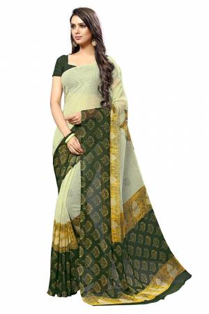 Add Some Casuals With This Pretty Printed Saree In Light Green Color. This Saree And Blouse Are Fabricated Chiffon Beautified With Prints. It Is Light In Weight And Easy To Carry All Day Long. 