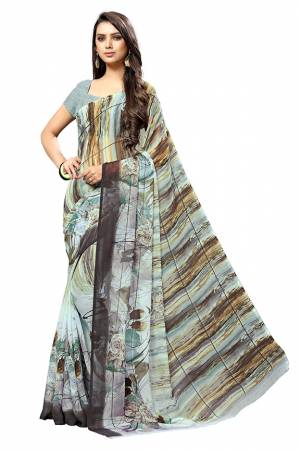 Add Some Casuals With This Pretty Printed Saree In Baby Blue Color. This Saree And Blouse Are Fabricated Chiffon Beautified With Prints. It Is Light In Weight And Easy To Carry All Day Long. 