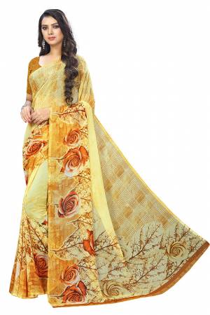 Simple And Elegant Looking Saree Is Here For Your Casual Or Semi-Casual Wear In Yellow Color. This Pretty Saree And Blouse Are Chiffon Based Beautified With Prints All Over. 