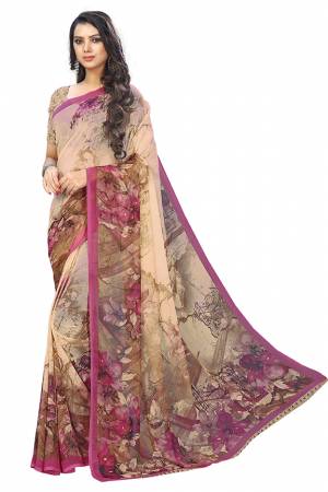 Here Is A Very Pretty Saree In Beige And Pink Color Fabricated On Chiffon. This Pretty Saree Is Beautified With Prints And It Is light In Weight Which Ensures Superb Comfort All Day Long. 