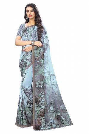 Add Some Casuals With This Pretty Printed Saree In Light Blue Color. This Saree And Blouse Are Fabricated Chiffon Beautified With Prints. It Is Light In Weight And Easy To Carry All Day Long. 
