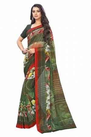 Here Is A Very Pretty Saree In Dark Green Color Fabricated On Chiffon. This Pretty Saree Is Beautified With Prints And It Is light In Weight Which Ensures Superb Comfort All Day Long. 