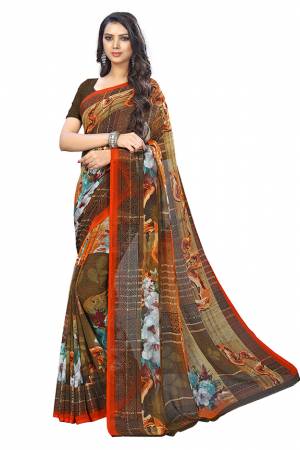 Add Some Casuals With This Pretty Printed Saree In Brown Color. This Saree And Blouse Are Fabricated Chiffon Beautified With Prints. It Is Light In Weight And Easy To Carry All Day Long. 