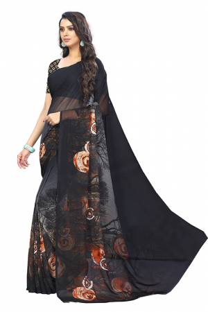 Simple And Elegant Looking Saree Is Here For Your Casual Or Semi-Casual Wear In Black Color. This Pretty Saree And Blouse Are Chiffon Based Beautified With Prints All Over. 