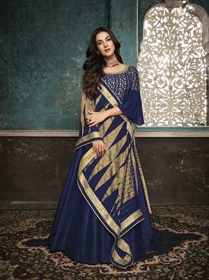 Adorn The Pretty Angelic Look Wearing This Designer Floor Length Suit In Royal Blue Color. Its Top Is Fabricated On Art Silk With Attractuve Embroidred Yoke And Bell Sleeve Paired With Santoon Bottom And Fancy Georgette Dupatta.