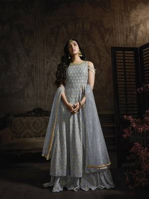 New Shade Is Here To Add Into Your Wardrobe With This Heavy Designer Suit In Steel Blue Color. Its Heavy Tone To Tone Embroidered Top Is Fabricated On Georgette Paired With Chiffon Bottom And Net Fabricated Dupatta. This Pretty Indo-Western Suit Pattern And Its Color Will Definitely Earn You Lots Of Compliments From Onlookers. 
