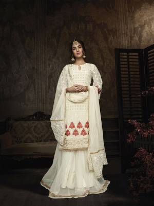 Flaunt Your Rich And Elegant Taste Wearing This Designer Suit In Off-White Color. Its Heavy Embroidered Top Is Fabricated On Georgette Paired With Net Fabricated Bottom And Dupatta. Buy This Lovely Suit Now.