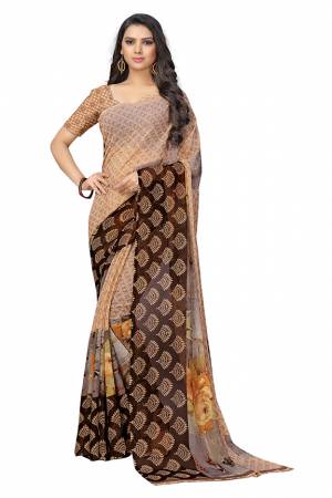 Simple And Elegant Looking Saree Is Here For Your Casual Or Semi-Casual Wear In Light Brown Color. This Pretty Saree And Blouse Are Chiffon Based Beautified With Prints All Over.