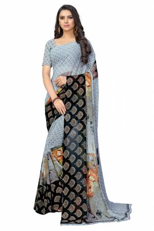 Add Some Casuals With This Pretty Printed Saree In Powder Blue Color. This Saree And Blouse Are Fabricated Chiffon Beautified With Prints. It Is Light In Weight And Easy To Carry All Day Long.