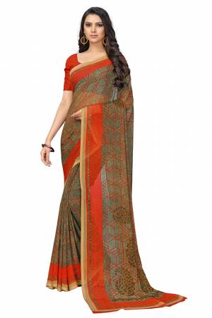 Beat The Heat This Summer Wearing This Pretty Light Weight Saree?In Orange And Green Color. This Saree And Blouse Are Fabricated On Chiffon Which Is Easy To Carry All Day Long.