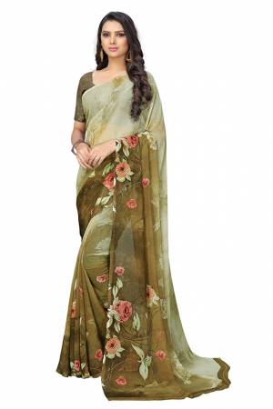 Simple And Elegant Looking Saree Is Here For Your Casual Or Semi-Casual Wear In Olive Green Color. This Pretty Saree And Blouse Are Chiffon Based Beautified With Prints All Over.
