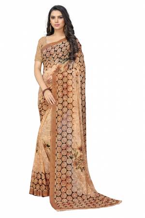 Beat The Heat This Summer Wearing This Pretty Light Weight Saree?In Light Brown Color. This Saree And Blouse Are Fabricated On Chiffon Which Is Easy To Carry All Day Long.