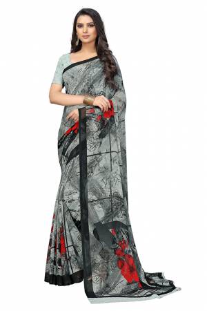 Add Some Casuals With This Pretty Printed Saree In Grey Color. This Saree And Blouse Are Fabricated Chiffon Beautified With Prints. It Is Light In Weight And Easy To Carry All Day Long.