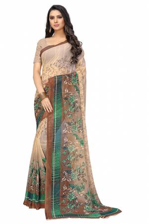 Here Is A Very Pretty Saree In Light Brown Color Fabricated On Chiffon.?This Pretty Saree Is Beautified With Prints And It Is light In Weight Which Ensures Superb Comfort All Day Long.