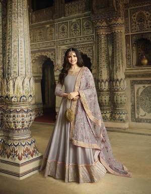 Grab This Heavy Designer Floor Length Suit In All Over Grey Color. Its Top Is Fabricated On Soft Silk Paired With Cotton Satin Bottom And Net Fabricated Dupatta Which Is Beautified With Heavy Attractive Embroidery. 