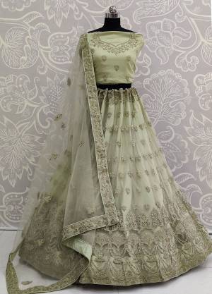 Look The Most Elegant Of All This Wedding Season Wearing This Heavy Designer Lehenga Choli In Pastel Green Color. This Beautiful Heavy Tone To Tone Embroidered Lehenga Choli Is Fabricated On Net. Its Rich Color and Detailed Embroidery Will earn You Lots Of Compliments From Onlookers
