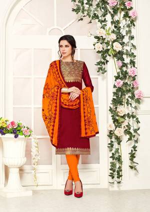 Celebrate This Festive Season In This Beautiful Designer Dress Material In Maroon Colored Top Paired with Contrasting Orange Colored Bottom And Dupatta. Its Top Is Banarasi Silk Based Paired With Cotton Bottom And Chiffon Fabricated Embroidered Dupatta. 