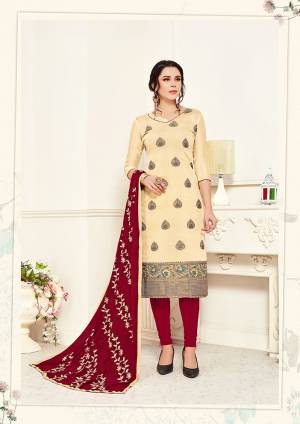 Celebrate This Festive Season In This Beautiful Designer Dress Material In Cream Colored Top Paired with Contrasting Maroon Colored Bottom And Dupatta. Its Top Is Banarasi Silk Based Paired With Cotton Bottom And Chiffon Fabricated Embroidered Dupatta. 