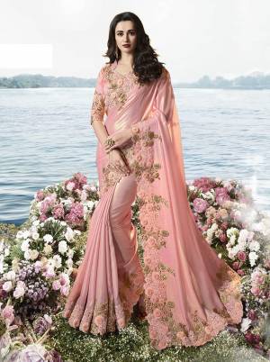 Look Pretty In This  Heavy Designer Saree In Pink Color Paired With Pink Colored Blouse. This Saree Is Fabricated On Tissue Silk Paired With Art Silk And Net Fabricated Blouse. It Is Beautified With Heavy Embroidered Attractive Lace Border. 