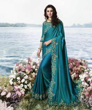 Here Is An Attractive Looking Lace Embroidered Designer Saree In Blue Color Paired With Blue Colored Blouse. This Saree Is Fabricated On Silk Georgette Paired With Art Silk And Net Fabricated Blouse. 