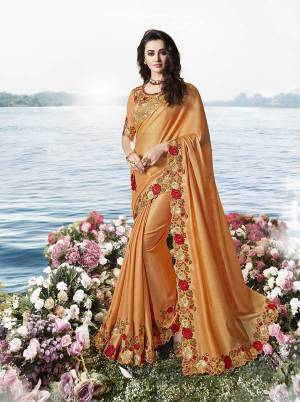 Flaunt Your Rich And Elagant Taste Wearing This Pretty Designer Saree In Orange Color Paired With Orange Colored Blouse. This Elegant Tone To Tone Embroidered Designer Saree Is Fabricated on Tissue Silk Paired With Art Silkn Fabricated Blouse. Buy This Rich Looking Saree Now.