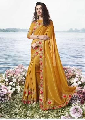 Celebrate This Festive Season Wearing This Heavy Designer Lehenga Style Saree In Musturd Yellow Color Paired With Musturd Yellow Colored Blouse. This Pretty Saree Is Tissue Silk Based Paired With Art Silk And Net Fabricated Blouse. Buy Now. 