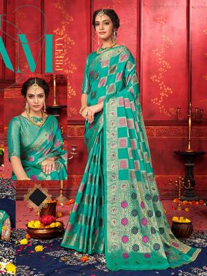 Enhance Your Personality Wearing This Designer Silk Based Saree In Sea Blue Color Paired With Sea Blue Colored Blouse. This Saree and Blouse Are Fabricated On Banarasi Silk Beautified With Weave With Attractive Checks Pattern. Buy Now.