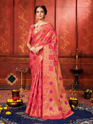 Here Is Bold And Beautiful Looking Saree For The Upcoming Festive Season In Dark Peach Color. This Saree And Blouse Are Fabricated On Banarasi Silk Beautified With Checks Pattern And Weave.