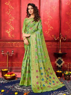 Enhance Your Personality Wearing This Designer Silk Based Saree In Green Color Paired With Green Colored Blouse. This Saree and Blouse Are Fabricated On Banarasi Silk Beautified With Weave With Attractive Checks Pattern. Buy Now.