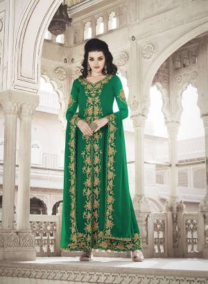 Celebrate This Festive And Wedding Season Wearing This Heavy Designer Suit In Green Color. Its Embroidered Top And Dupatta are Fabricated On Georgette Paired With Soft Silk Fabricated Embroidred Bottom. 