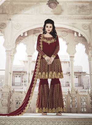 Grab This Very Beautiful And Attractive Looking Heavy Designer Sharara Suit In Maroon Color. Its Top And Dupatta Are Fabricated on Georgette Paired With Soft Silk Bottom. Its Top, Bottom And Dupatta Are Beautified With Heavy Jari And Stone Work. 