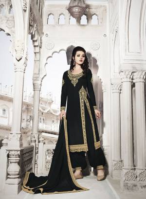 Grab This Very Beautiful And Attractive Looking Heavy Designer Suit In Black Color. Its Top And Dupatta Are Fabricated on Georgette Paired With Soft Silk Bottom. Its Top, Bottom And Dupatta Are Beautified With Heavy Jari And Stone Work. 