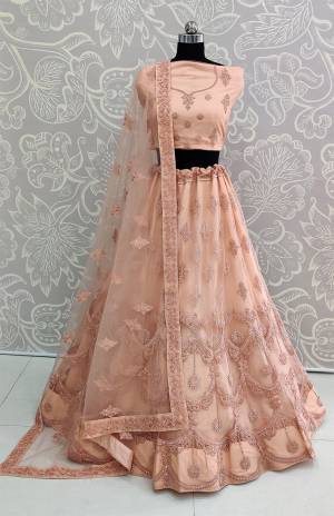 Look The Most Elegant Of All This Wedding Season Wearing This Heavy Designer Lehenga Choli In Light Peach Color. This Beautiful Heavy Tone To Tone Embroidered Lehenga Choli Is Fabricated On Net. Its Rich Color and Detailed Embroidery Will earn You Lots Of Compliments From Onlookers