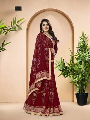 Here Is A Pretty Saree For Your Casual Or Semi Casual Wear In Maroon Color. This Saree And Blouse Are Fabricated On Georgette Beautified With Prints All Over. 