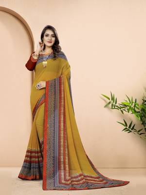 Simple And Elegant Looking Printed Saree In Yellow And Red Color .This Printed Saree And Blouse Are Georgette Based Which Is Light In Weight And Ensures Superb Comfort All Day Long. 