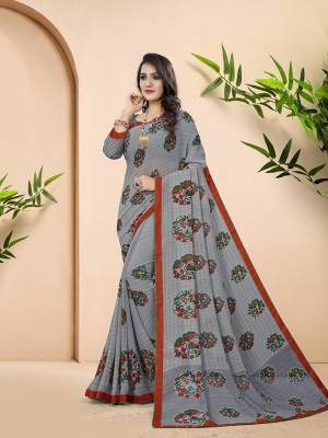 Here Is A Pretty Saree For Your Casual Or Semi Casual Wear In Grey Color. This Saree And Blouse Are Fabricated On Georgette Beautified With Prints All Over. 