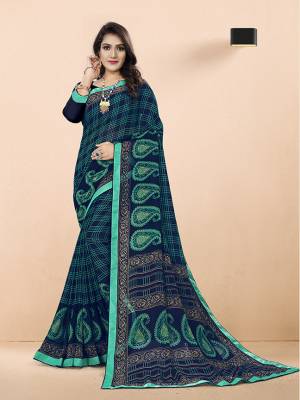 Get Ready For This Summer With Some Light Weight Printed Saree. This Printed Saree Is Navy Blue Color Is Fabricated On Georgette Which Is Easy To Drape And Carry All Day Long.