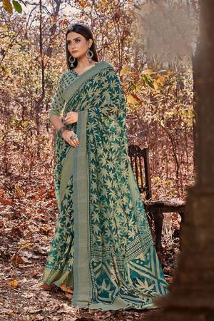 Rich And Elegant Looking Cotton Based Saree Is Here In Teal Green Color .This Saree Is Fabricated on Cotton Brasso Paired With Art Silk Fabricated Blouse. Buy This Pretty Saree Now.