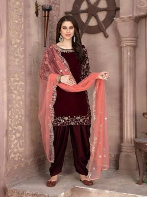 Get Ready For The Upcoming Festive And Wedding Season With This Designer Patiala Suit In Maroon Color Paired With Dark Peach Colored Dupatta. Its Embroidered Top Is Fabricated On Velvet Paired With Santoon Bottom And Net Fabricated Embroidered Dupatta. It Is Light Weight And Easy To Carry Throughtout The Gala. Buy this Semi-Stitched Suit Now.
