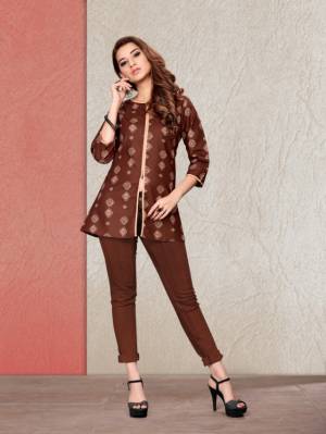 Here Is A Readymade Printed Short Kurti In Brown Color Fabricated On Cotton. It Is Beautified With Prints And Available In All Regular Sizes. You Can Pair This Up With Pants Or Denim. Buy Now. 