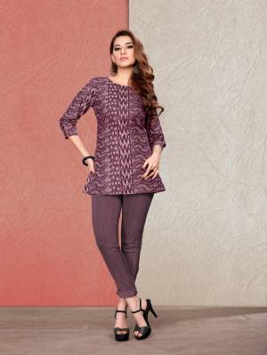 For Your Semi-Casual Wear, Grab This Printed Readymade Short Kurti In Wine Fabricated On Cotton. It Is Light In Weight And Easy To Carry All Day Long. 