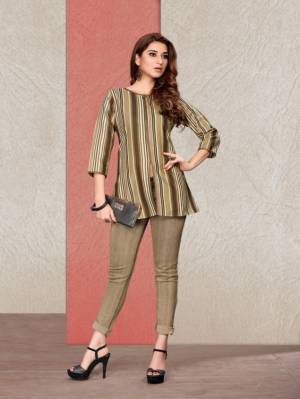 Here Is A Readymade Printed Short Kurti In Beige Color Fabricated On Cotton. It Is Beautified With Prints And Available In All Regular Sizes. You Can Pair This Up With Pants Or Denim. Buy Now. 