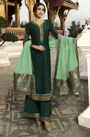Grab This Beautiful Designer Suit In Dark Green Color Paired With Light Green Colored Dupatta. Its Pretty Top Is Fabricated On Satin Georgette Paired With Santoon Bottom And Chinon Fabricated Dupatta. Its Pretty Top Is Beautified With Attractive Elegant Embroidery Which Will Earn You Lots Of Compliments From Onlookers.