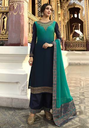 Add This Beautiful Heavy Designer Suit To Your Wardrobe In Navy Blue Color Paired With Turquoise Blue Colored Dupatta. Its Top Is Satin Georgette Based Paired With Santoon Bottom And Chinon Fabricated Dupatta. Buy This Semi-Stitched Suit Now.