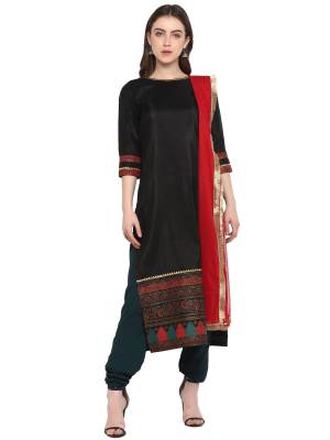 Add This Designer Readymade Suit To Your Wardrobe In Black Colored Top Paired With Dark Green Colored Bottom and Red Colored Dupatta. Its Top Is Fabricated On Poly Silk Paired With Crepe Bottom And Net Fabricated Dupatta. 